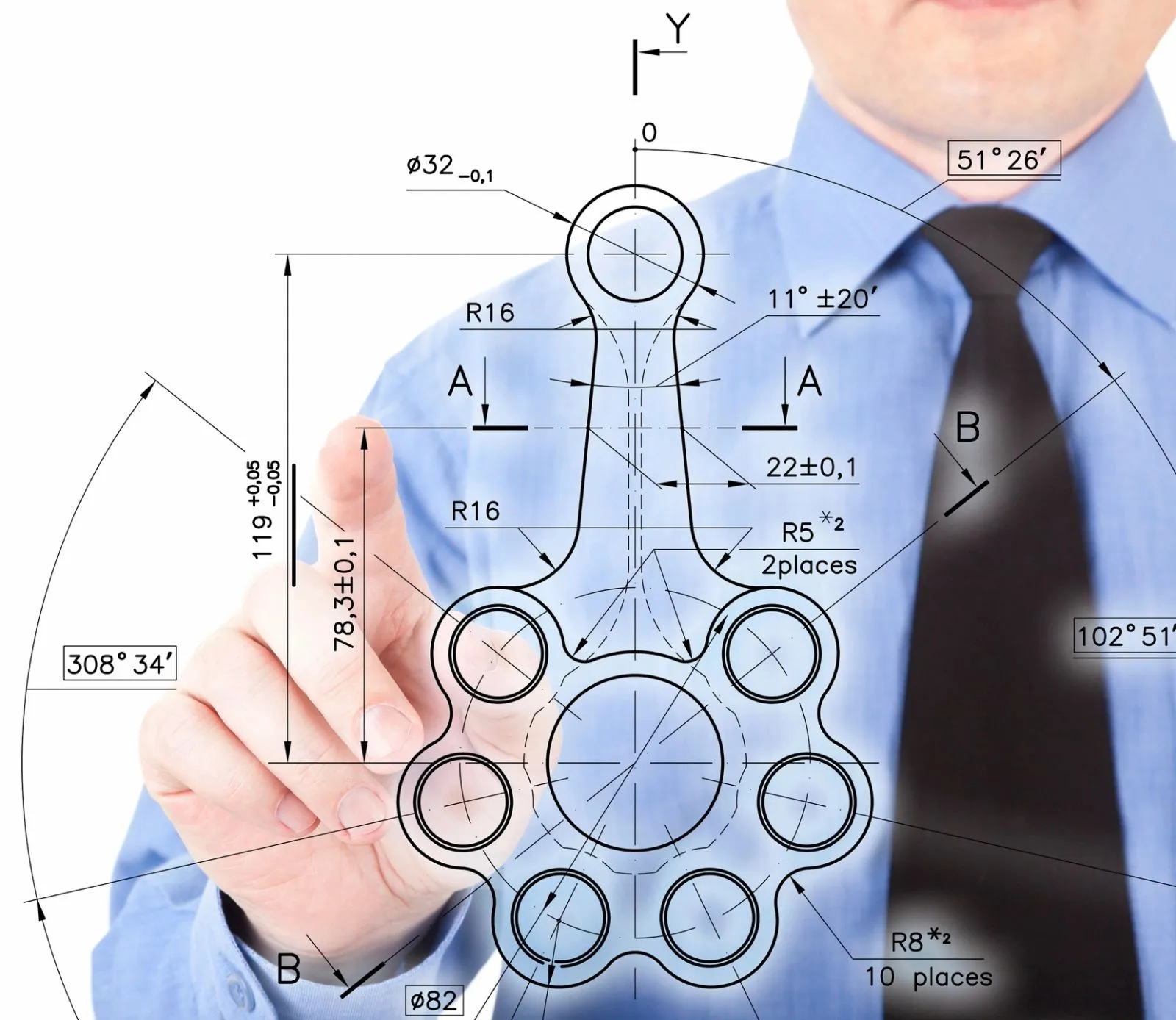 Engineer reviewing a dimensioned technical drawing