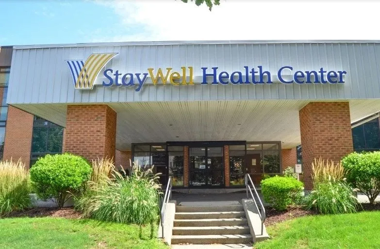 Brick health center building with a covered entrance