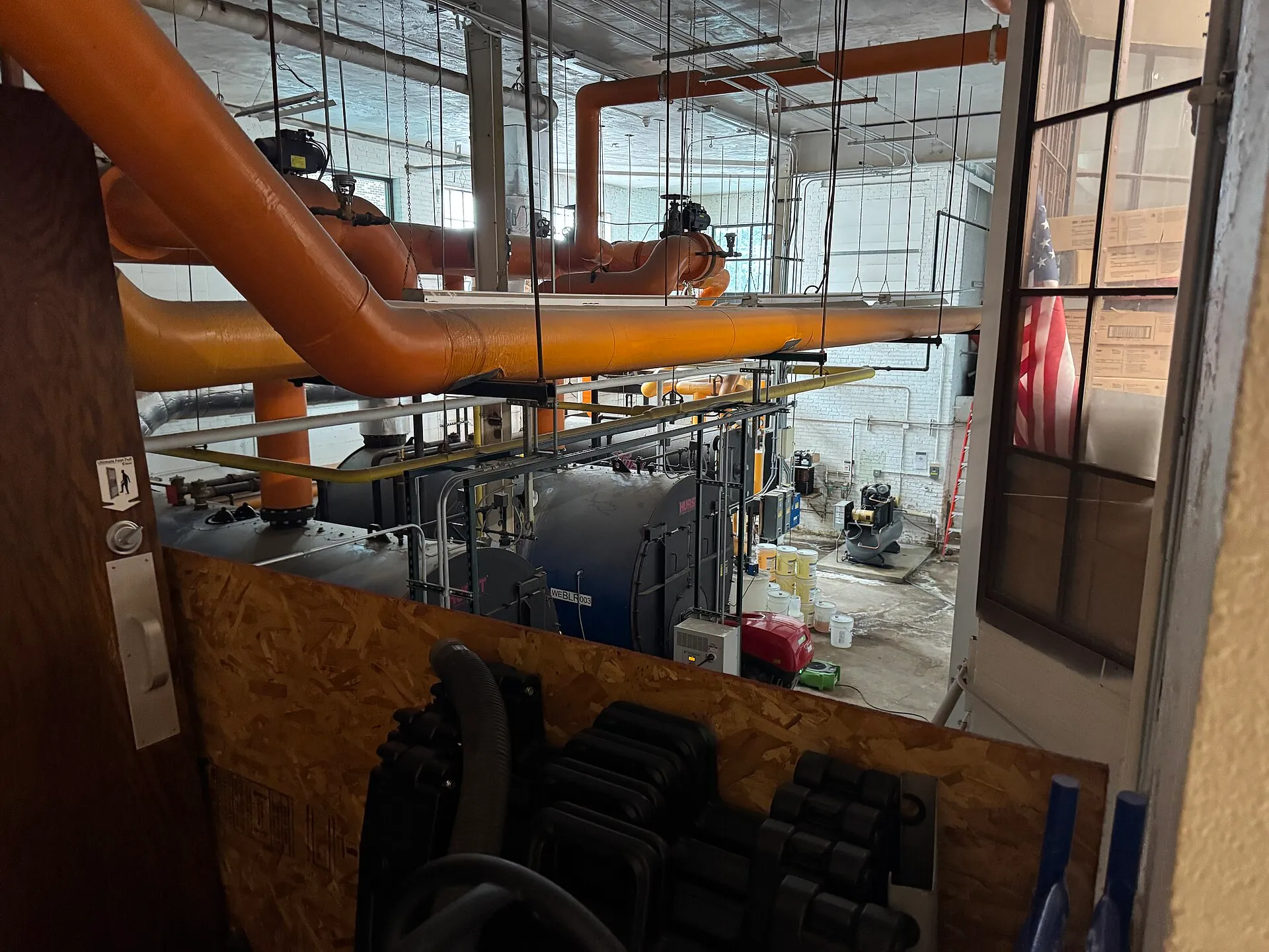 Boilers and heating piping in a building mechanical room