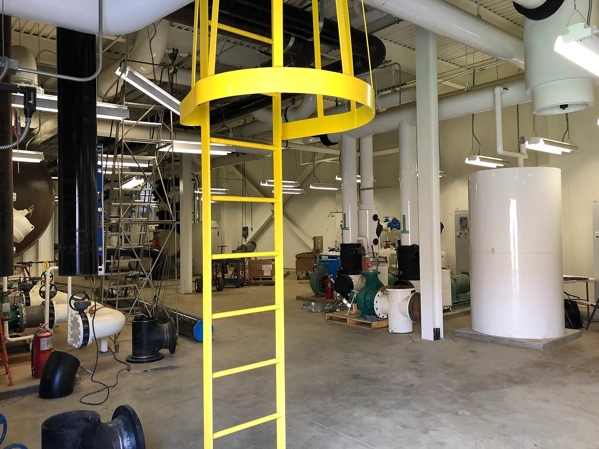 Chiller plant interior with pumps, headers and large diameter piping